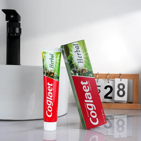 Herbal toothpaste tube and green retail packaging